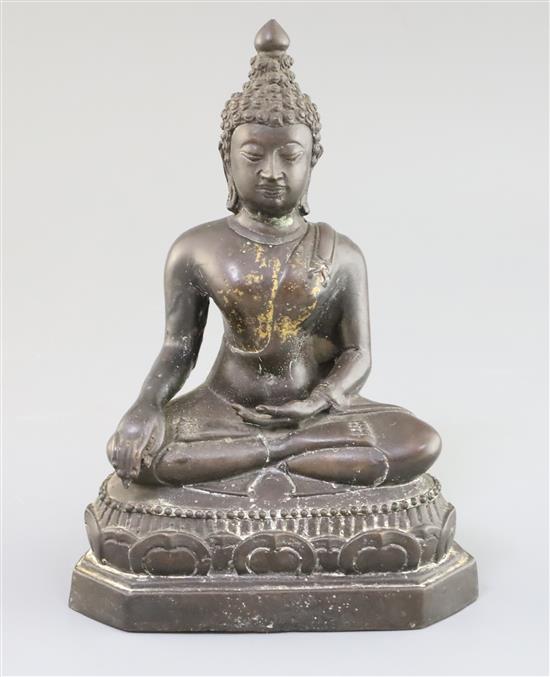 A Thai brown patinated bronze seated figure of Buddha H. 20.5cm